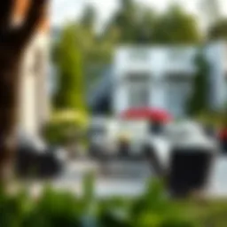 Elegant black wicker sectional patio furniture set in a serene outdoor setting.