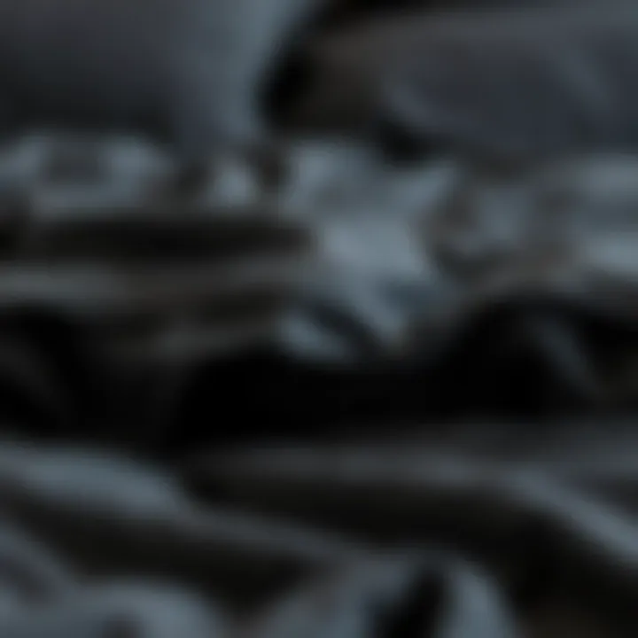 Close-up of luxurious fabric texture of dark gray bedding