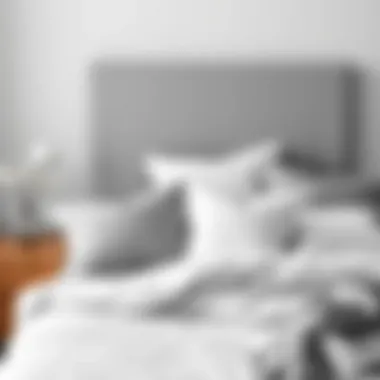 Arrangement of grey and white bedding with a minimalist aesthetic