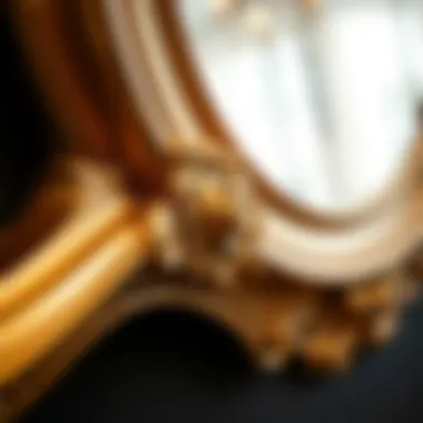 Close-up of intricate design on a gold mirror frame
