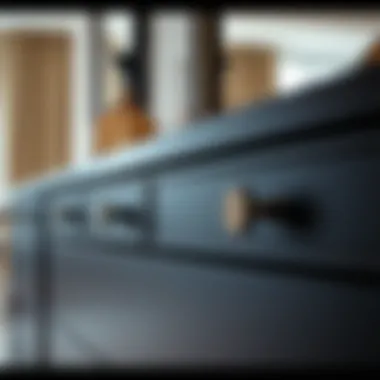 Close-up of black dresser detailing and mirror reflection